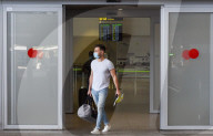 EU travel quarantine restrictions - travellers at Malaga airport 