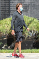 Sean Stewart lets his actress girlfriend Helen OÍGara carry his boxing gloves as he limps away from an hour-long boxing class at a private gym in Los Angeles.