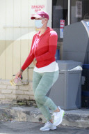 Multi-millionaire model Amber Rose makes three separate trips to the same gas station to buy ïSet for LifeÍ $10 lottery scratch cards. 
