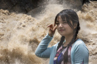 Tourists visit Tiger Leaping Gorge during high water