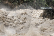 Tourists visit Tiger Leaping Gorge during high water