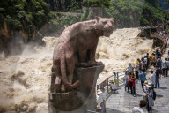Tourists visit Tiger Leaping Gorge during high water