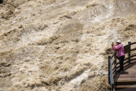Tourists visit Tiger Leaping Gorge during high water