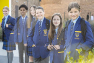 Year 7 pupils arrive for their first day at Eden Park high school.