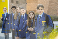 Year 7 pupils arrive for their first day at Eden Park high school.