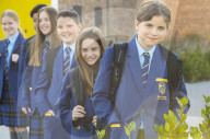 Year 7 pupils arrive for their first day at Eden Park high school.