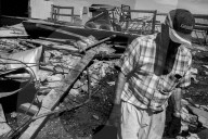 Iowa's farmers count the cost of a rare storm – photo essay. The hurricane-like storm, called a derecho, tore through Iowa this month, damaging buildings and threatening the harvest.