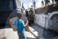 Migrants flee following a fire at Moria camp in Lesvos, Greece - 11 Sept 2020