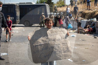 Migrants flee following a fire at Moria camp in Lesvos, Greece - 11 Sept 2020