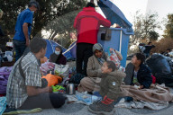 Migrants flee following a fire at Moria camp in Lesvos, Greece - 11 Sept 2020