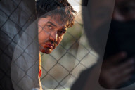 Migrants flee following a fire at Moria camp in Lesvos, Greece - 11 Sept 2020
