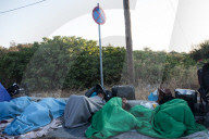 Migrants flee following a fire at Moria camp in Lesvos, Greece - 11 Sept 2020