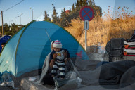 Migrants flee following a fire at Moria camp in Lesvos, Greece - 11 Sept 2020