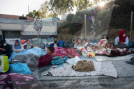 Migrants flee following a fire at Moria camp in Lesvos, Greece - 11 Sept 2020