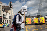 Port of Dover is brought to a standstill by far-right groups. Flag-waving extremists and white nationalists block roads in protest over migrant Channel crossings 