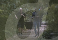 Boris Johnson running with his trainer this morning in Westminster. 