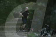Boris Johnson running with his trainer this morning in Westminster. 