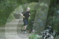 Boris Johnson running with his trainer this morning in Westminster. 