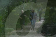 Boris Johnson running with his trainer this morning in Westminster. 