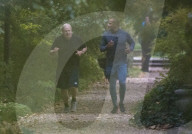 Boris Johnson running with his trainer this morning in Westminster. 