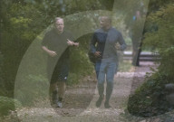 Boris Johnson running with his trainer this morning in Westminster. 