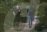 Boris Johnson running with his trainer this morning in Westminster. 
