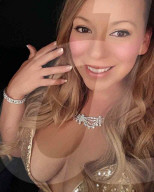 FEATURE - Lookalike: Ex-Militärpolizistin kassiert über 1500 Pfund pro Stunde als Mariah Carey Doppelgängerin