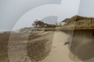 Gale-force winds blow away £20m sandscaping project in North Norfolk.