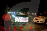 A line of visitors stretches along a roadside outside Haunted Drive in Splendora, Texas, Sept. 25, 2020. (Brandon Thibodeaux/The New York Times)