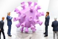 NEWS - Coronavirus: Figur vor Coronavirus mit Impfspritze
