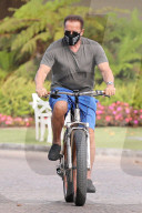 Arnold Schwarzenegger, 73 and his long term girlfriend of 5 years, Heather Milligan, 45 are spotted taking their bikes for an early morning ride in Santa Monica, CA