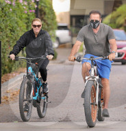 Arnold Schwarzenegger, 73 and his long term girlfriend of 5 years, Heather Milligan, 45 are spotted taking their bikes for an early morning ride in Santa Monica, CA