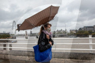 Commuters get caught in Storm Alex on thier way to work this moring in London as wind and rain lash the UK. 