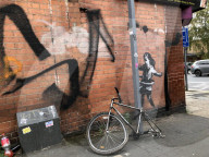 Banksy confirms hula-hoop girl mural in Nottingham is hisArtwork showing girl playing with a bicycle tyre appeared on street corner last week