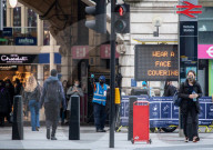 Office workers arrive in Westminster, London today as ONS figures reveal unemployment rises by a further 138,000.