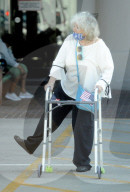Hollywood veteran Connie Stevens, 82, shows sheÍs still full of energy and good humor as she kicks back her heels and does a fun little dance despite needing the help of an adult walker. 