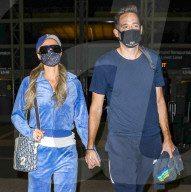 PREMIUM EXCLUSIVE Paris Hilton Dons Comfy Tracksuit For Anniversary Vacation With Carter Reum
