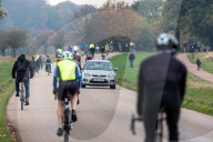 Members of the public go out for a Sunday walk and cycle in a packed Richmond Park in South West London as Police patrol the park.
