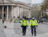 Police patrol the streets as London goes into its first day of lockdown.