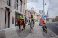 Police patrol the streets as London goes into its first day of lockdown.