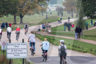 Members of the public go out for a Sunday walk and cycle in a packed Richmond Park in South West London 
