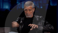 George Clooney demonstrates the hair cutter he has been using to keep trim during lockdown