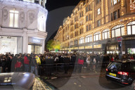 A large crowd of young people outside Harrods, Knightsbridge, London.