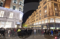 A large crowd of young people outside Harrods, Knightsbridge, London.