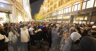 A large crowd of young people outside Harrods, Knightsbridge, London.