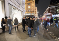 A large crowd of young people outside Harrods, Knightsbridge, London.
