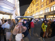 A large crowd of young people outside Harrods, Knightsbridge, London.