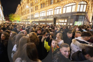 A large crowd of young people outside Harrods, Knightsbridge, London.