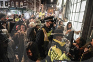 Christmas revellers make the most of the last night of bars being open before London is moved to Tier 3 restrictions.