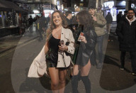 Christmas revellers make the most of the last night of bars being open before London is moved to Tier 3 restrictions.